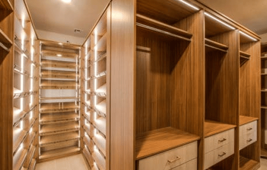 bright luxury closet with high end closet lighting upgrades
